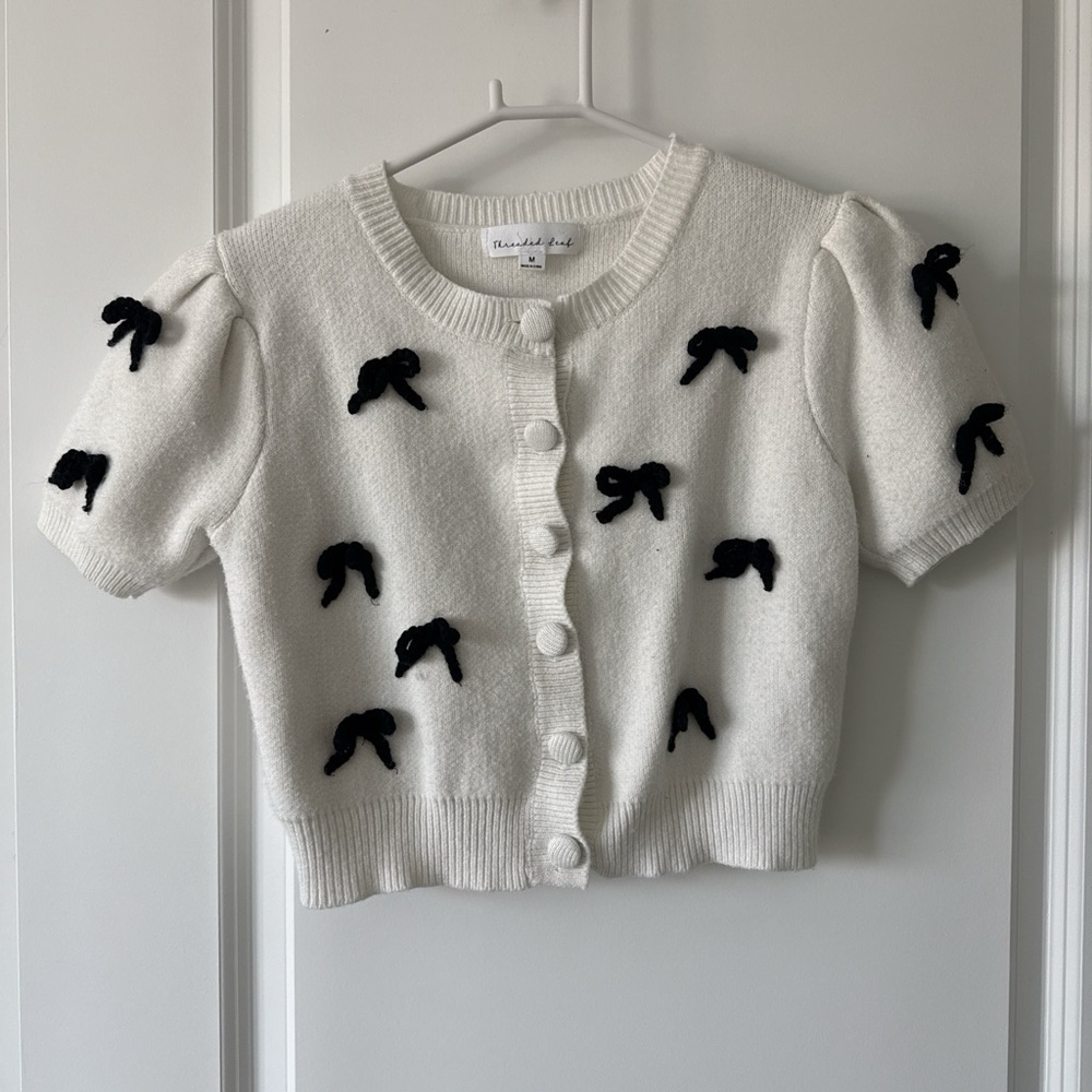 White Cardigan with Black Bow Accents